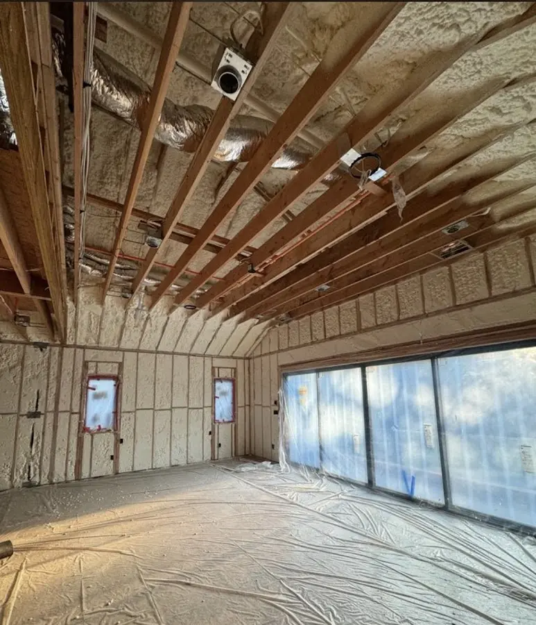 Interior walls and ceiling insulated with spray foam during new construction in Concord